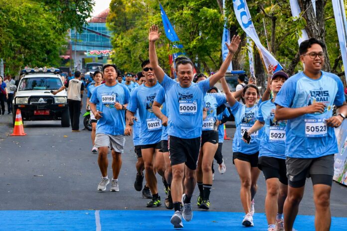 Sekda Provinsi Bali Dewa Made Indra mengikuti QRIS Bali Summer Run 2026 di kawasan Renon, Denpasar, sekaligus mendorong perluasan penggunaan QRIS hingga ke desa.